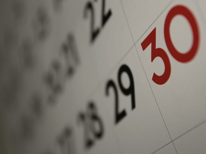 Close-up of calendar dates 28, 29 and 30