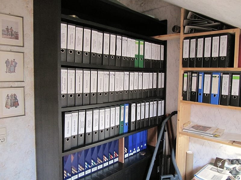 Shelves of labelled box files